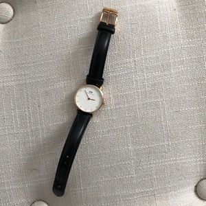 Black and gold Daniel Wellington watch
